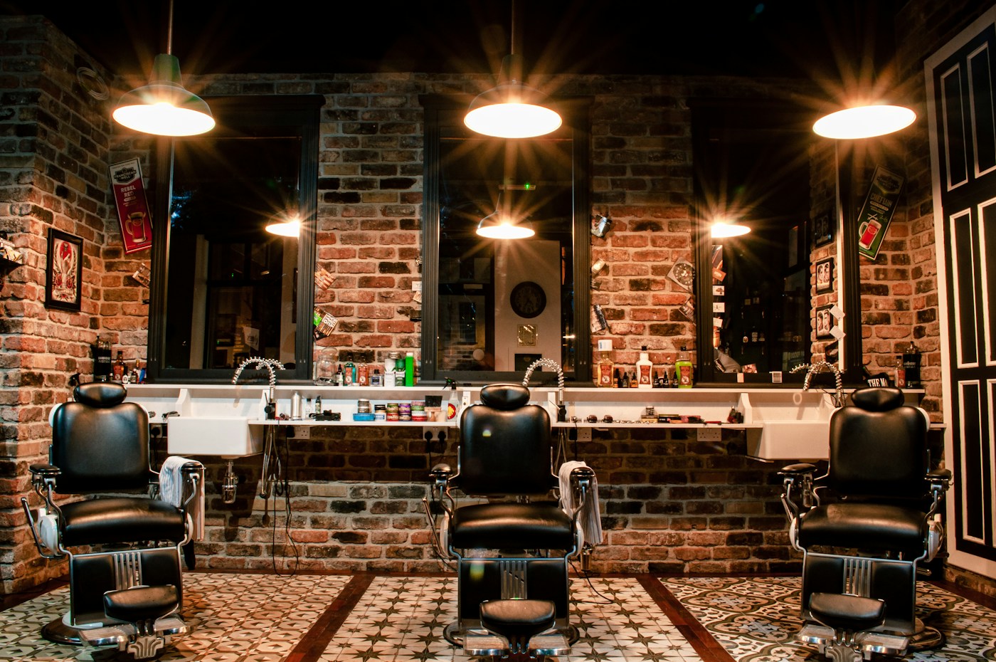Classic barbershop with leather chairs and brick walls